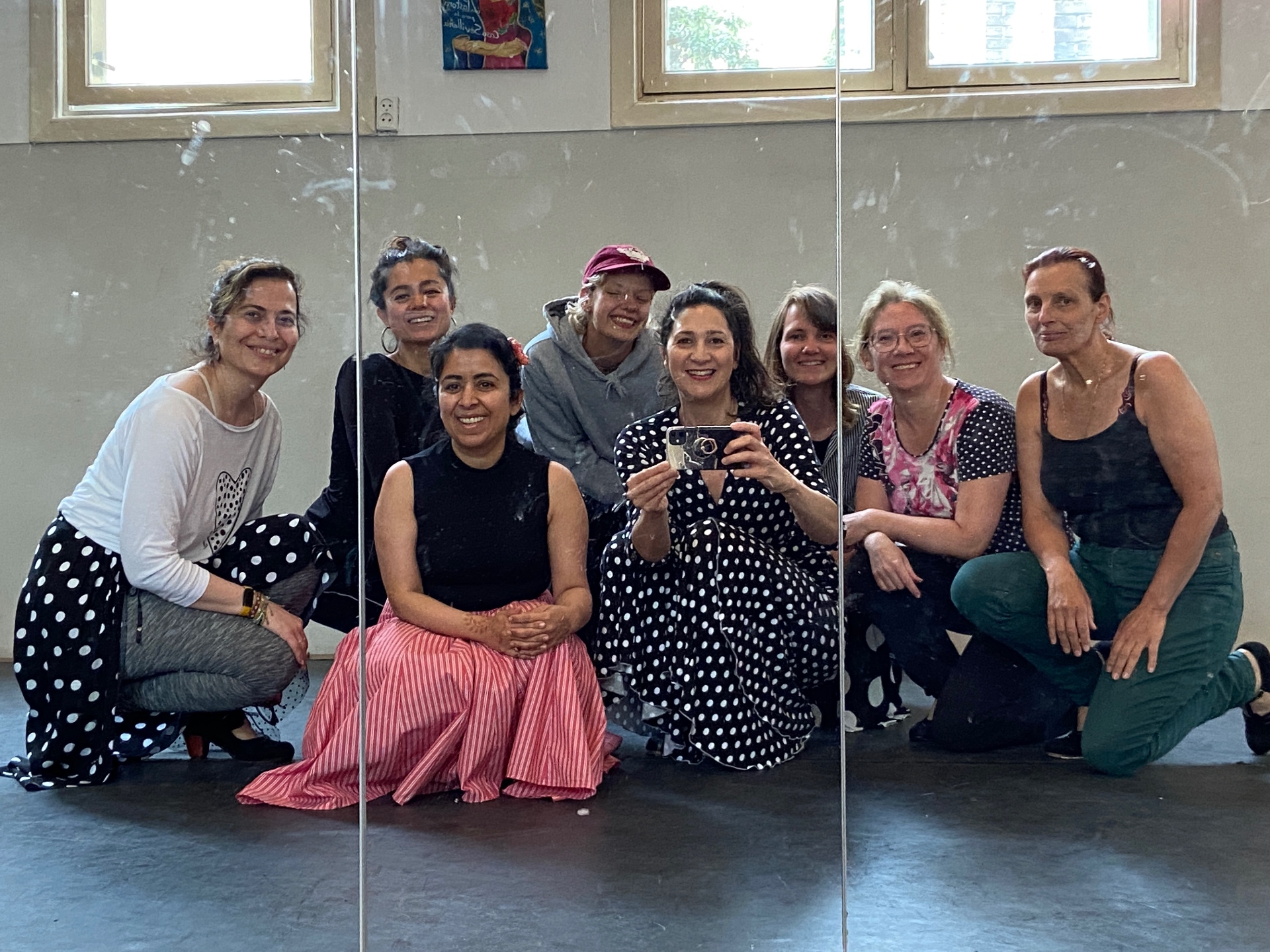 Group of students posing together in the studio mirror