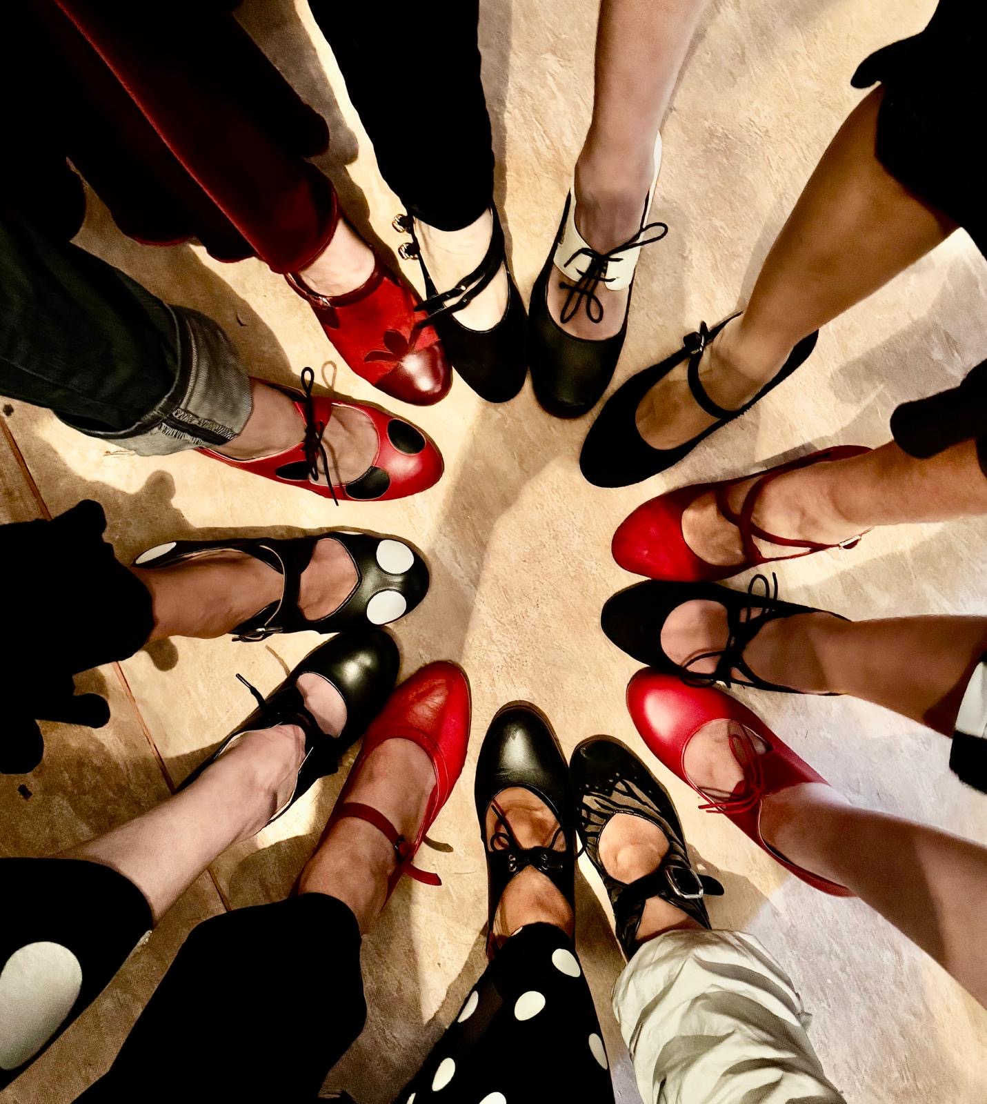 Circle of flamenco dancers' shoes on the studio floor